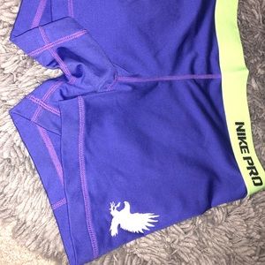 Purple and neon green Nike spandex